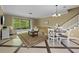 Open-concept living area showcasing stylish furnishings, tile flooring, and a seamless flow at 934 Rock Harbor Ave, Orlando, FL 32828