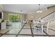 Bright living area with tile floors, a dining area, a staircase, and access to the screened-in patio at 934 Rock Harbor Ave, Orlando, FL 32828