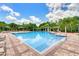 Resort-style pool with brick patio, lounge chairs, shade structures at 934 Rock Harbor Ave, Orlando, FL 32828