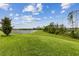 Picturesque backyard with a scenic view of the tranquil lake and surrounding natural landscape at 9844 Beach Port Dr, Winter Garden, FL 34787