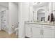 This bathroom includes a stylish vanity with granite countertops and a shower with themed curtain at 9844 Beach Port Dr, Winter Garden, FL 34787