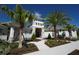 A beautifully landscaped walkway leads to the welcoming entrance of this stylish community clubhouse at 9844 Beach Port Dr, Winter Garden, FL 34787