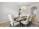Open concept dining room with modern chandelier and an open floorplan at 9844 Beach Port Dr, Winter Garden, FL 34787