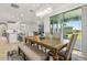 Open concept dining area leading to a living room, kitchen, and an outdoor seating area at 9844 Beach Port Dr, Winter Garden, FL 34787