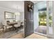 View from the front door, looking into the elegant dining room and foyer at 9844 Beach Port Dr, Winter Garden, FL 34787