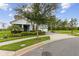 Charming two-story home features a well-manicured lawn and an inviting light blue color at 9844 Beach Port Dr, Winter Garden, FL 34787