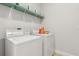 Functional laundry area with a Speed Queen washer and dryer at 9844 Beach Port Dr, Winter Garden, FL 34787