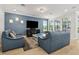 Spacious living room with modern furnishings, neutral paint, plenty of natural light, and hardwood floors at 9844 Beach Port Dr, Winter Garden, FL 34787