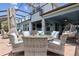 Outdoor patio area with woven furniture, perfect for relaxation and entertaining at 9844 Beach Port Dr, Winter Garden, FL 34787