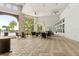 Large covered patio with tables and chairs, great for outdoor gatherings and relaxation near the pool at 9844 Beach Port Dr, Winter Garden, FL 34787