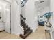 Staircase leading upstairs, with view into living room and bright hallway at 9844 Beach Port Dr, Winter Garden, FL 34787