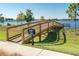 Scenic waterfront park featuring a charming wooden dock and walkway, providing serene views of the lake at 9844 Beach Port Dr, Winter Garden, FL 34787