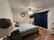 Bedroom with hardwood floors, ceiling fan and bright window at 101 Grand Plaza Dr # P40, Orange City, FL 32763