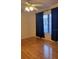 Bedroom showcasing a hardwood floor, a window, and a ceiling fan at 101 Grand Plaza Dr # P40, Orange City, FL 32763