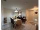 Traditional dining room featuring a large table set for a meal and a decorative lighting fixture above at 101 Grand Plaza Dr # P40, Orange City, FL 32763