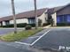 Condominium exterior featuring front parking and landscaping at 101 Grand Plaza Dr # P40, Orange City, FL 32763