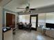 Cozy living room with a ceiling fan and natural light streaming through the windows at 101 Grand Plaza Dr # P40, Orange City, FL 32763