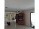 Living room featuring tile floors and a mirrored wall at 101 Grand Plaza Dr # P40, Orange City, FL 32763