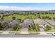 Aerial view of home showcasing landscaping, lawn and neighborhood location at 1212 Zeek Ridge St, Clermont, FL 34715