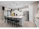Spacious kitchen featuring a large island, pendant lighting, stainless steel appliances, and tiled flooring at 1212 Zeek Ridge St, Clermont, FL 34715