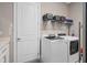 Modern laundry room featuring a new washer and dryer, optimizing convenience and efficiency at 1212 Zeek Ridge St, Clermont, FL 34715
