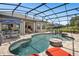 Gorgeous screened-in pool area with lounge chairs and outdoor dining, perfect for entertaining at 1212 Zeek Ridge St, Clermont, FL 34715