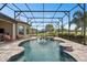 Stunning screened pool area with lush landscaping, creating a private backyard oasis at 1212 Zeek Ridge St, Clermont, FL 34715
