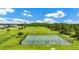 Overhead view of basketball courts in park-like setting with green grass and trees at 12216 Prairie Plantation Way, Orlando, FL 32824