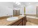 Spacious bathroom with double sink vanity, granite countertop, and separate tub and shower at 12216 Prairie Plantation Way, Orlando, FL 32824