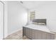 Bedroom with a tiled floor, a bed, one window with blinds and white walls at 12216 Prairie Plantation Way, Orlando, FL 32824