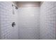 A bathroom with white subway tile and a chrome shower head at 1335 E 3Rd Ave, Mount Dora, FL 32757