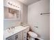 Bathroom features grey vanity, mirror, and a shower at 1335 E 3Rd Ave, Mount Dora, FL 32757