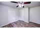 Bedroom featuring ceiling fan, closet and new flooring at 1335 E 3Rd Ave, Mount Dora, FL 32757