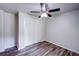Spacious bedroom with new flooring, closet and a ceiling fan at 1335 E 3Rd Ave, Mount Dora, FL 32757