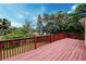 Spacious outdoor deck, perfect for entertaining or relaxing, with scenic views of the surrounding greenery at 1335 E 3Rd Ave, Mount Dora, FL 32757