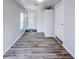 Hallway features new flooring, neutral paint and white doors at 1335 E 3Rd Ave, Mount Dora, FL 32757
