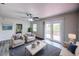 Inviting living room with stylish decor and a sliding glass door to the outdoor deck at 1335 E 3Rd Ave, Mount Dora, FL 32757