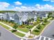 An aerial view shows a community with rows of houses and well-kept lawns at 14366 Walcott Ave, Orlando, FL 32827