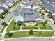 Aerial view of a light-blue home with a well-kept lawn and patio furniture in a residential neighborhood at 14366 Walcott Ave, Orlando, FL 32827