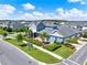 High angle aerial of the community with lush landscaping, a home with a covered patio, and exterior curb appeal at 14366 Walcott Ave, Orlando, FL 32827