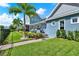 Backyard featuring manicured lawn, a beautiful patio with outdoor seating, ideal for entertaining and relaxation at 14366 Walcott Ave, Orlando, FL 32827
