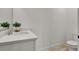 Bathroom featuring a quartz countertop, a sink, and a chrome faucet with light wood flooring at 14366 Walcott Ave, Orlando, FL 32827