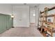 Bedroom featuring a ladder shelf, accent wall, and double door closet with neutral-toned carpet at 14366 Walcott Ave, Orlando, FL 32827
