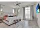 Bright bedroom with large windows, wood floors, and ceiling fan at 14366 Walcott Ave, Orlando, FL 32827