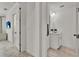 Hallway featuring doorways to the bathroom and bedroom with light wood flooring at 14366 Walcott Ave, Orlando, FL 32827