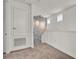 Hallway with carpet flooring and a decorative stone accent wall with wall sconces for a unique design element at 14366 Walcott Ave, Orlando, FL 32827