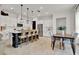 Spacious kitchen with island seating and stainless steel appliances, adjacent dining table at 14366 Walcott Ave, Orlando, FL 32827