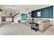 Bright living room with a modern fireplace, tiled floors, and an open staircase, creating a welcoming space at 14366 Walcott Ave, Orlando, FL 32827