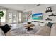 Bright living room with tile flooring, doors leading to the outside, and a comfortable seating area at 14366 Walcott Ave, Orlando, FL 32827