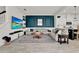 Inviting living room featuring tile floors, a stylish accent wall, and a comfortable seating area for relaxation at 14366 Walcott Ave, Orlando, FL 32827
